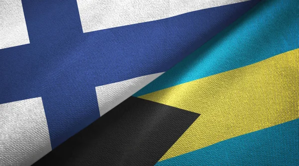 Finlandia e Bahamas due bandiere tessuto, tessitura tessuto — Foto Stock