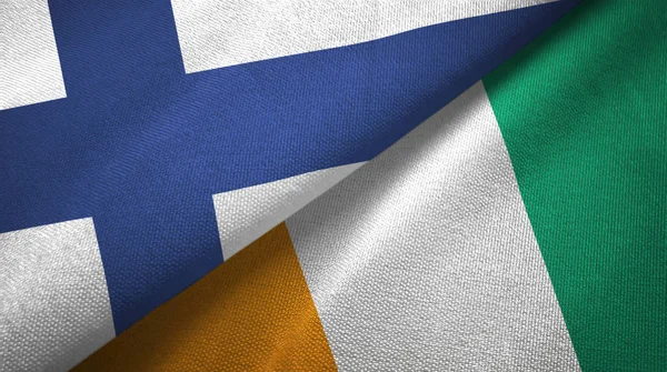 芬兰和科特迪瓦象牙海岸两面旗帜织物织物质地 — 图库照片