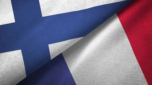 Finlandia e Francia due bandiere tessuto, tessitura tessuto — Foto Stock