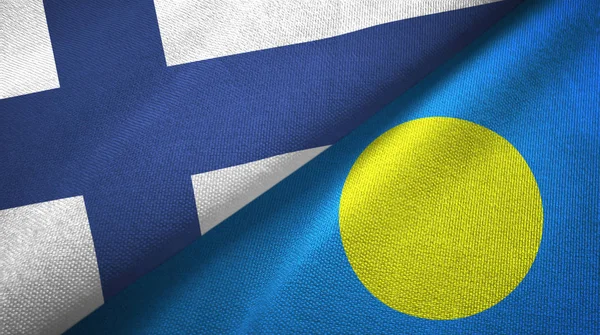 Финляндия и Палау два флага текстильная ткань, текстура ткани — стоковое фото