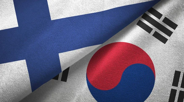 Finlandia e Corea del Sud due bandiere tessuto, tessitura tessuto — Foto Stock