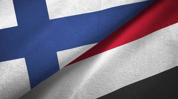 Финляндия и Йемен два флага текстильная ткань, текстура ткани — стоковое фото