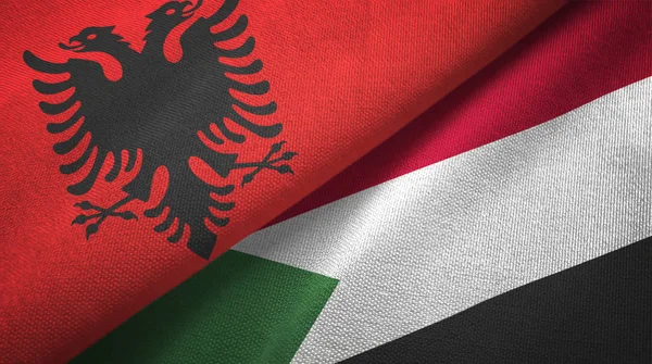 Albania and Sudan two flags textile cloth, fabric texture — Stock Photo, Image