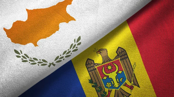 Cyprus en Moldavië twee vlaggen textiel doek, weefsel textuur — Stockfoto