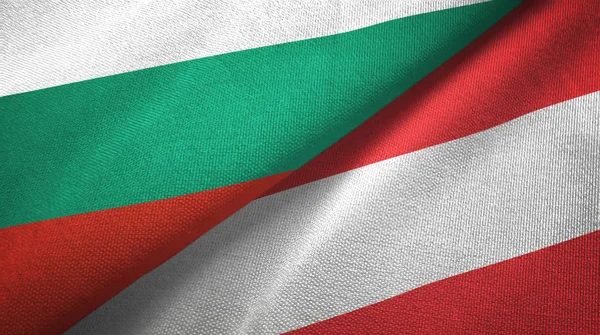 Bulgarije en Oostenrijk twee vlaggen textiel doek, weefsel textuur — Stockfoto