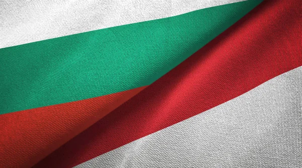 Bulgarije en Indonesië twee vlaggen textiel doek, weefsel textuur — Stockfoto