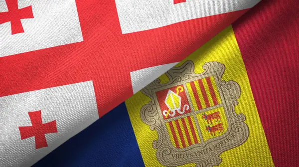 Geórgia e Andorra duas bandeiras de pano têxtil, textura de tecido — Fotografia de Stock