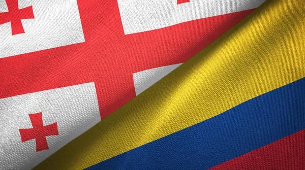 Georgien och Colombia två flaggor textil tyg, tyg konsistens — Stockfoto