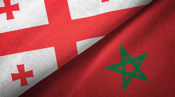 Georgië en Marokko twee vlaggen textiel doek, weefsel textuur — Stockfoto