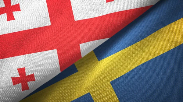 Gürcistan ve İsveç iki bayraklar tekstil kumaş, kumaş doku — Stok fotoğraf