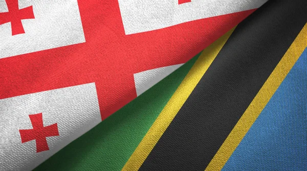 Georgia y Tanzania dos banderas tela textil, textura de la tela — Foto de Stock