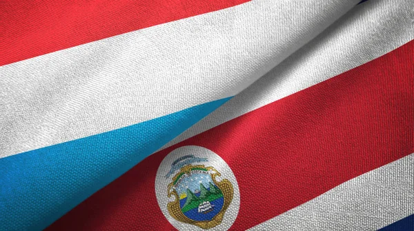 Lüksemburg ve Kosta Rika iki bayraklar tekstil kumaş, kumaş doku — Stok fotoğraf