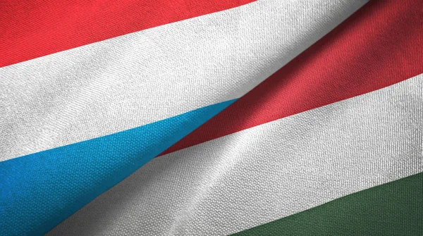 Люксембург і Угорщина два прапори текстильна тканина, текстура тканини — стокове фото