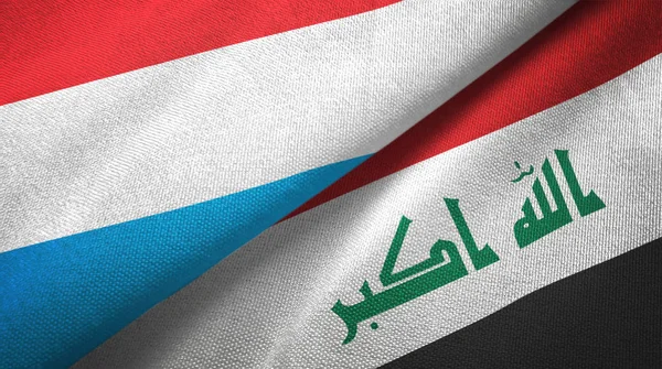 Люксембург і Ірак два прапори текстильної тканини — стокове фото