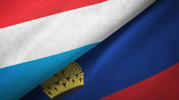 Lussemburgo e Liechtenstein due bandiere tessuto, tessitura tessuto — Foto Stock