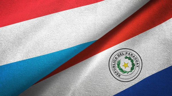 Luxembourg and Paraguay two flags textile cloth, fabric texture — Stock Photo, Image