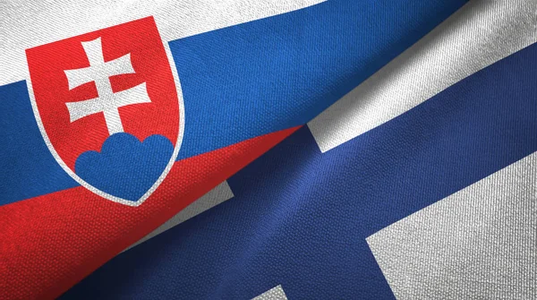 Словаччина і Фінляндія два прапори текстильної тканини, текстура тканини — стокове фото