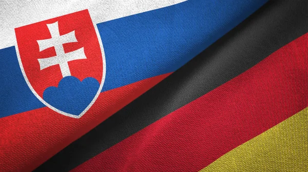 Slovakia and Germany two flags textile cloth, fabric texture — Stock Photo, Image