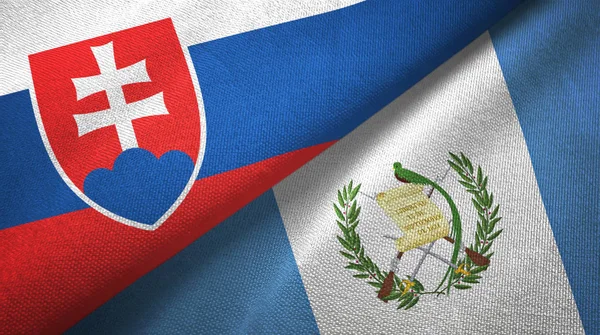 Словаччина і Гватемала два прапори текстильної тканини, текстура тканини — стокове фото