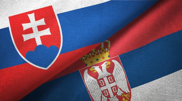 Slovakien och Serbien två flaggor textil tyg, tyg konsistens — Stockfoto