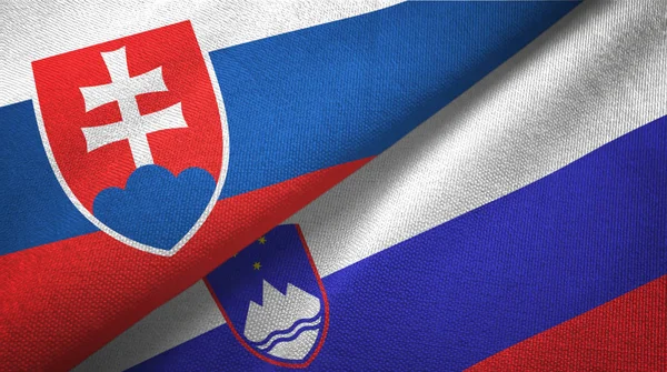 Slovakia and Slovenia two flags textile cloth, fabric texture — Stock Photo, Image