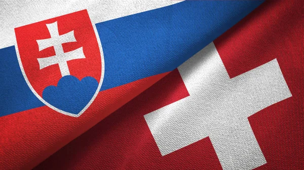 Slovakien och Schweiz två flaggor textil tyg, tyg konsistens — Stockfoto