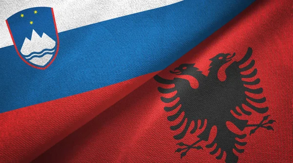 Slovenia and Albania two flags textile cloth, fabric texture
