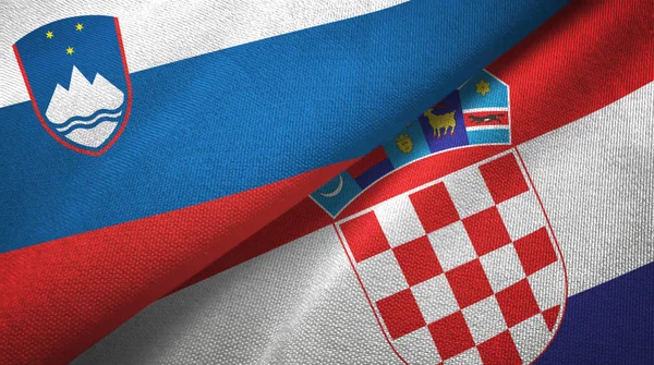 Eslovénia e Croácia duas bandeiras de pano têxtil, textura de tecido — Fotografia de Stock