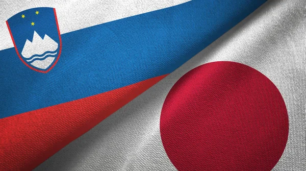 スロベニアと日本の2つの旗織物布、生地の質感 — ストック写真