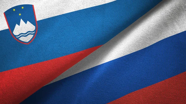Szlovénia és Oroszország két zászló Textil szövet, szövet textúra — Stock Fotó
