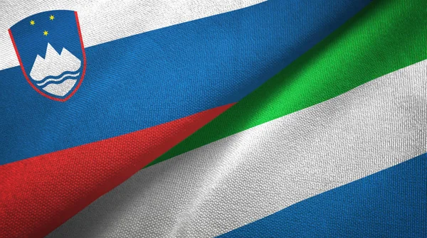 Slovinsko a Sierra Leone dvě vlajky textilní tkaniny, textura — Stock fotografie