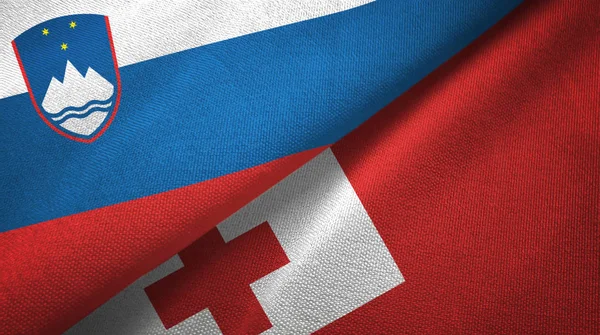 Eslovenia y Tonga dos banderas tela textil, textura de la tela —  Fotos de Stock