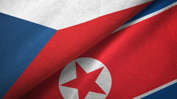 Tsjechische Republiek en Noord-Korea twee vlaggen textiel doek, weefsel textuur — Stockfoto