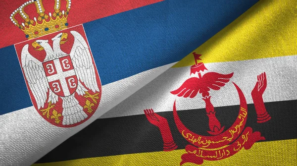 Сербия и Бруней два флага текстильная ткань — стоковое фото