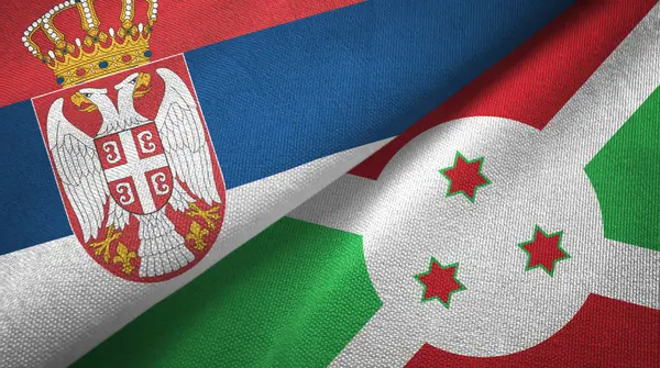 Serbia y Burundi dos banderas tela textil, textura de la tela — Foto de Stock
