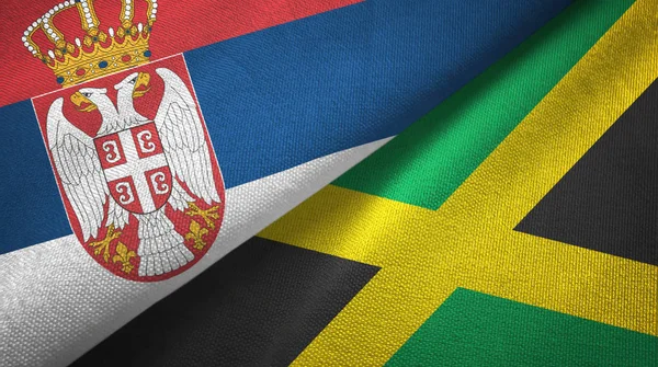 Serbia and Jamaica two flags textile cloth, fabric texture — Stock Photo, Image