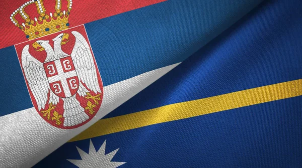 Serbien och Nauru två flaggor textil tyg, tyg konsistens — Stockfoto