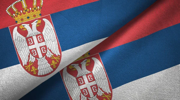 Serbien zwei Flaggen Textiltuch, Textilstruktur — Stockfoto