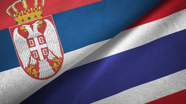 Sırbistan ve Tayland iki bayrak tekstil kumaş, kumaş doku — Stok fotoğraf