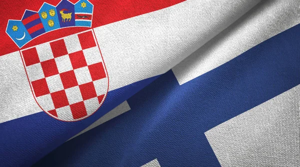 Chorwacja i Finlandia dwie flagi tkanina tekstylna, tekstura tkaniny — Zdjęcie stockowe