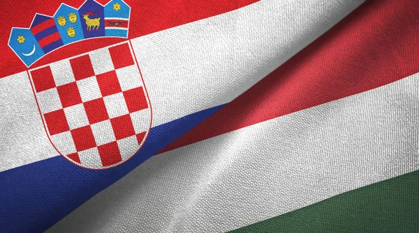 Kroatien och Ungern två flaggor textil tyg, tyg konsistens — Stockfoto