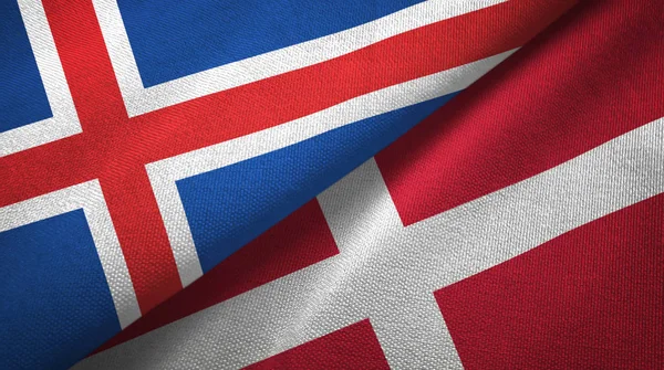 Ісландія і Данія два прапори текстильна тканина, текстура тканини — стокове фото