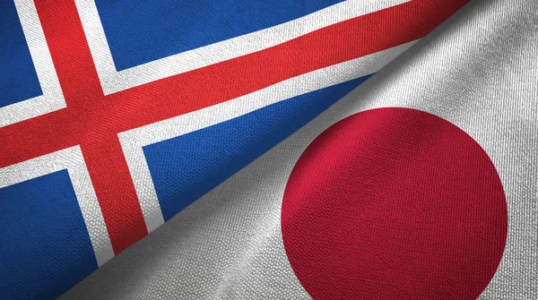 Islandia i Japonia dwie flagi tkanina tekstylna, tekstura tkaniny — Zdjęcie stockowe