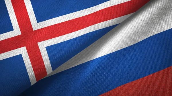 Ісландія і Росія два прапори текстильна тканина, текстура тканини — стокове фото