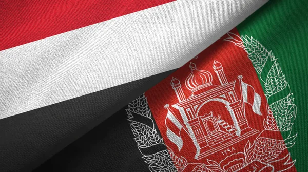 Yemen y Afganistán dos banderas tela textil, textura de la tela — Foto de Stock