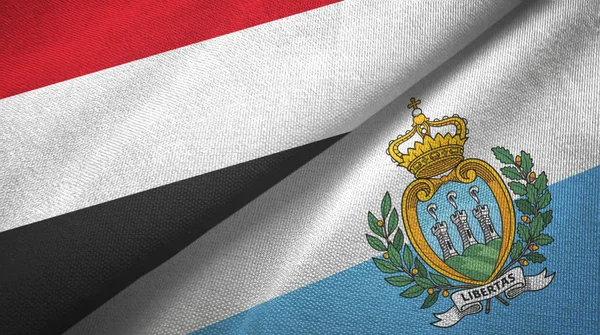 Yemen y San Marino dos banderas tela textil, textura de la tela — Foto de Stock