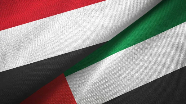Yemen and United Arab Emirates two flags textile cloth, fabric texture — Stock Photo, Image