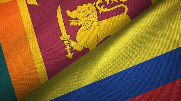 Sri Lanka e Colômbia duas bandeiras de pano têxtil, textura de tecido — Fotografia de Stock