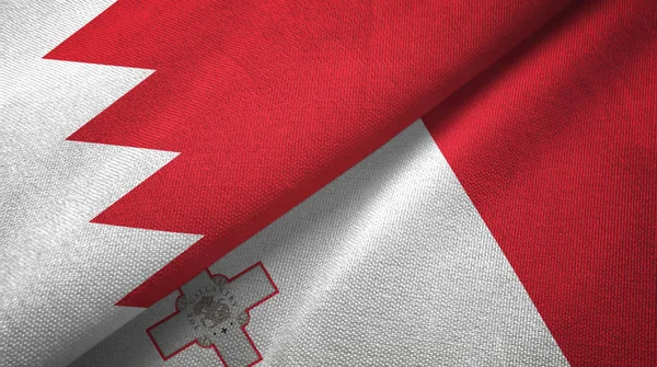 Bahrain och Malta två flaggor textil trasa, tyg textur — Stockfoto