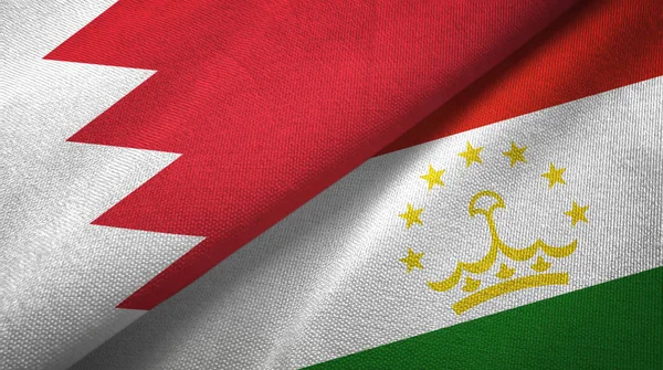 Το Μπαχρέιν και το Τατζικιστάν δύο σημαίες υφαντικές ύλες, υφασμάτινη υφή — Φωτογραφία Αρχείου